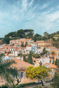 Buildings in town against sky