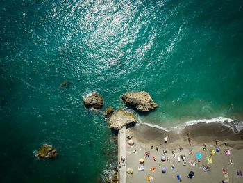 Aerial view of people by sea at beach