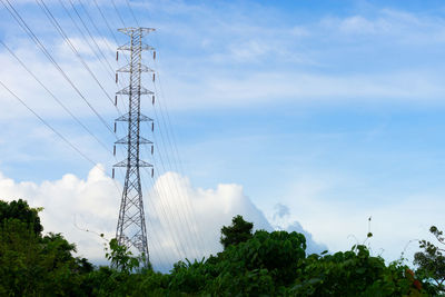 Low angle view of electricity pylon against sky