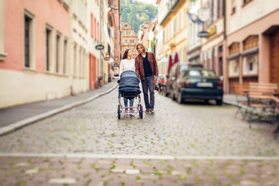 Woman walking on street in city