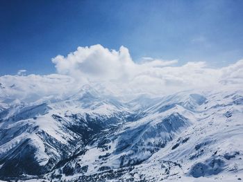 Scenic view of landscape against cloudy sky