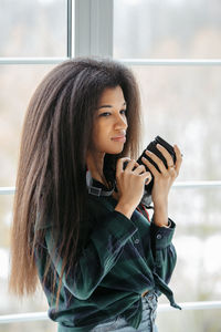 Young woman using mobile phone