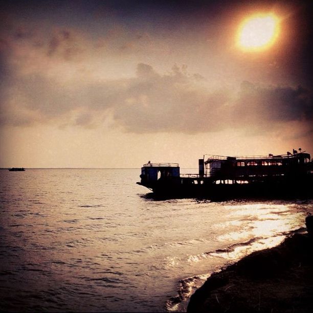 sea, water, sky, sunset, scenics, waterfront, cloud - sky, beauty in nature, horizon over water, tranquil scene, built structure, building exterior, tranquility, nature, architecture, dusk, cloudy, idyllic, cloud, beach