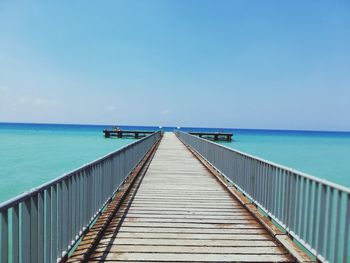 Pier over sea against sky