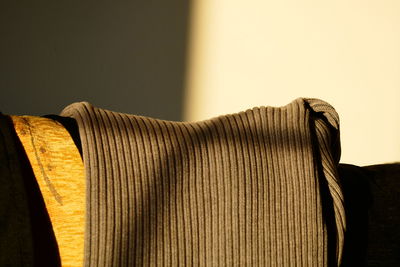 Close-up of sweater on sofa at home