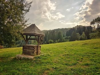 Built structure on field against sky