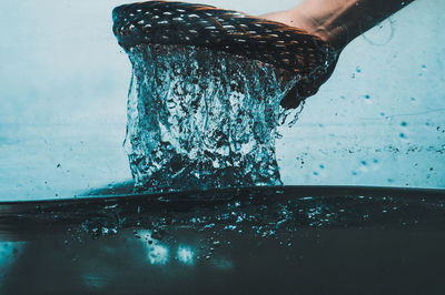 Close-up of hand holding water