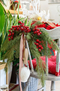 Close-up of red flowers in basket on table