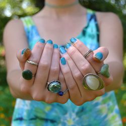 Midsection of woman wearing rings