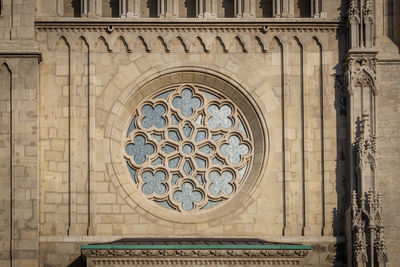 Low angle view of ornate window of building