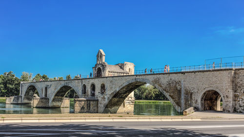 Arch bridge against blue sky