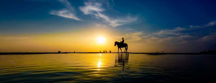 Scenic view of sunset over lake