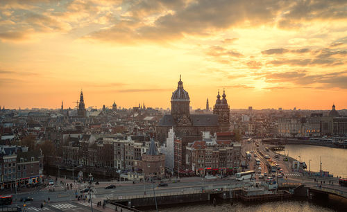 Cityscape against sky during sunset