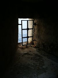 Abandoned building seen through window