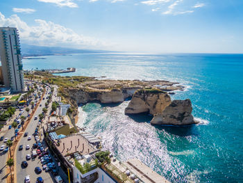 High angle view of rocks in sea against sky