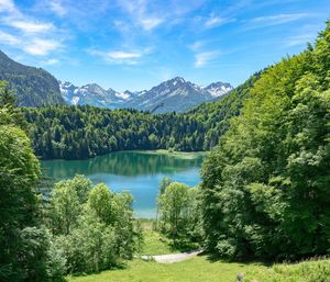 Scenic view of lake and mountains against sky