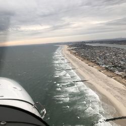 Scenic view of sea against sky seen from airplane