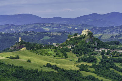 Scenic view of landscape and mountains against sky