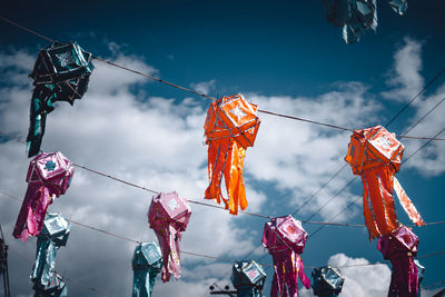 Low angle view of decoration hanging against sky