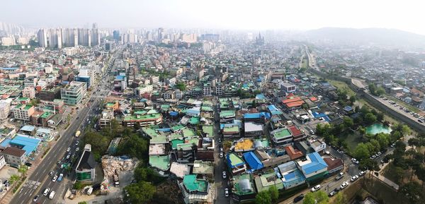 High angle view of buildings in city against sky