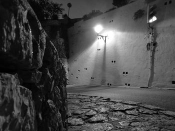 Illuminated road against sky