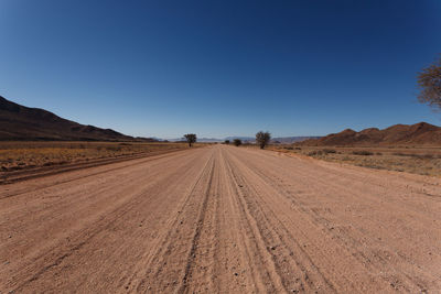 Dirt road passing through a desert