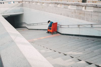 High angle view of young woman on road