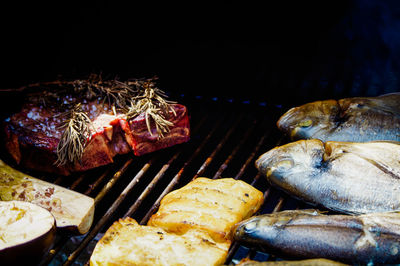 Close-up of meat on barbecue grill