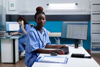 Portrait of doctor working in office