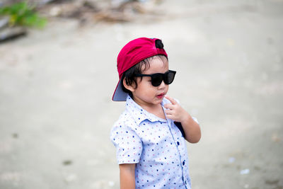 Close-up cute boy wearing sunglasses