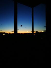 Silhouette of airplane window