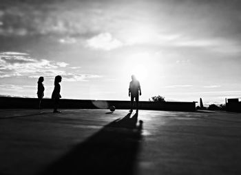 Silhouette of woman at sunset