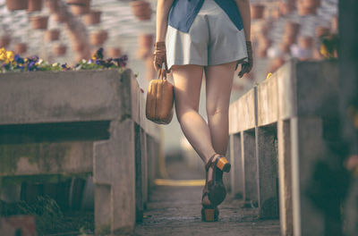 Low section of woman walking outdoors