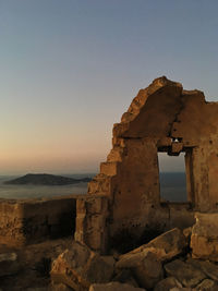 Old ruins of building against clear sky