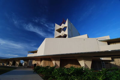 Buildings against blue sky and clouds
