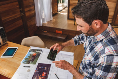 High angle view of man working on table