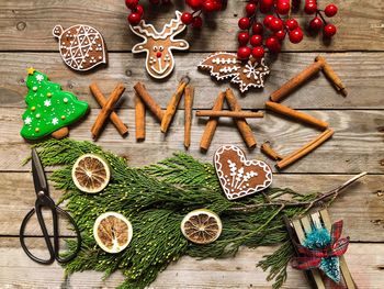 High angle view of christmas decoration and food on wooden table