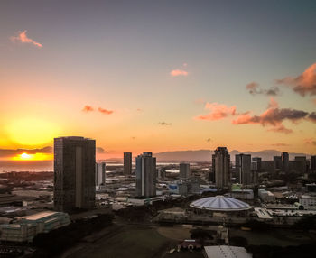 High angle view of buildings against sky during sunset