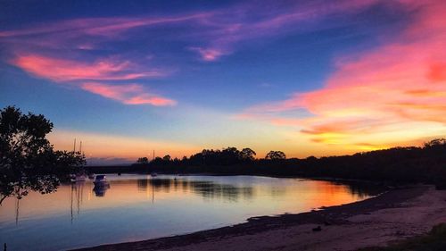 Scenic view of lake against sky during sunset