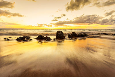 Scenic view of sea against sky during sunset