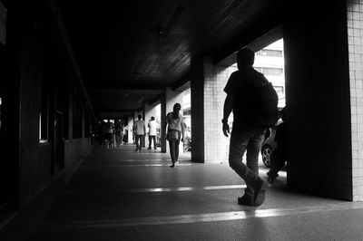 People walking in corridor