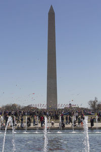 Group of people in front of built structure