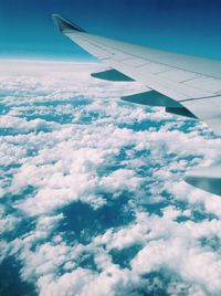 Cropped image of airplane flying over landscape