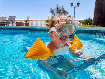 Portrait of woman swimming in pool