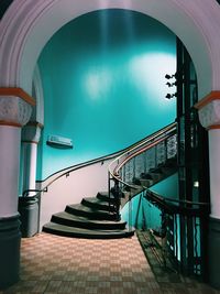 Directly below shot of spiral staircase against building