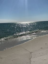 Scenic view of beach against clear sky