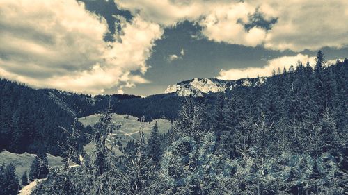 Scenic view of mountains against sky during winter