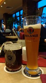 Close-up of beer glass on table at restaurant