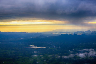 Aerial view of landscape against dramatic sky