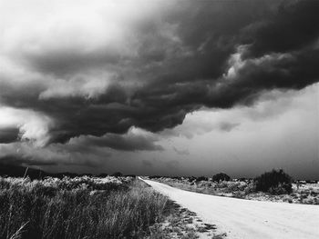 Scenic view of landscape against cloudy sky